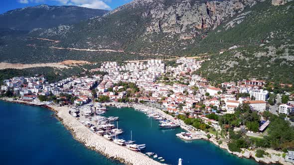 The top view from the drone of Kas resorts, bay, yahts, city in Mugla in Turkey alt