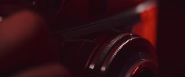 Photographer pressing the shutter button close up alt