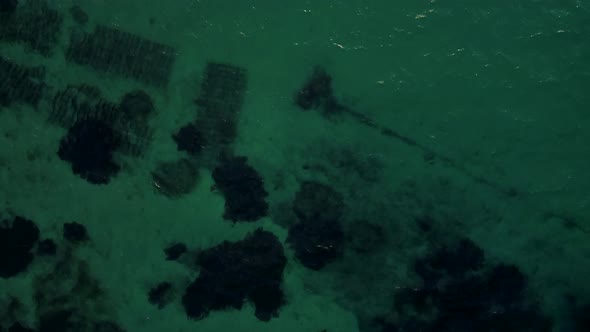 Drone Flying Over the Ocean with Coral Reef alt