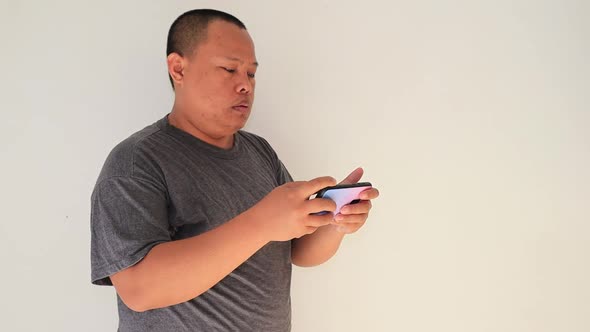 Man playing game on his smartphone