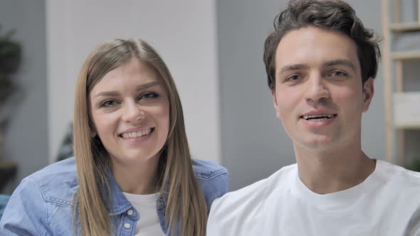 Online Video Chat By Young Couple on Couch alt