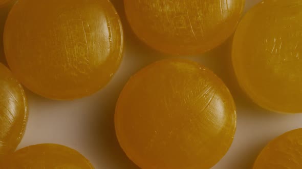 Rotating shot of butterscotch candies - CANDY BUTTERSCOTCH 036 alt
