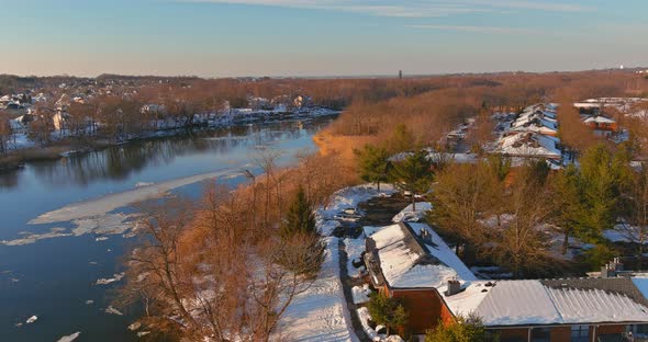 Ice Drift on the River in Early Spring of Ice Float Down the Stream View Apartment Complex From a alt