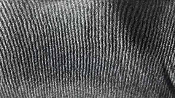 Highly detailed grey cloth fabric fluttering on the wind. Loopable animation 4K