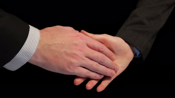 Closeup of Businessmen Shaking Hands
