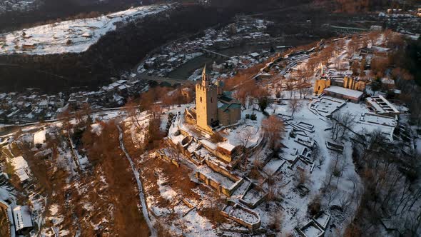 Aerial video above a hill with an old fortress alt