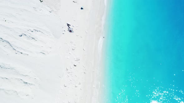 Drone view of scenic beach with white sand and turquoise sea, Greek islands. alt