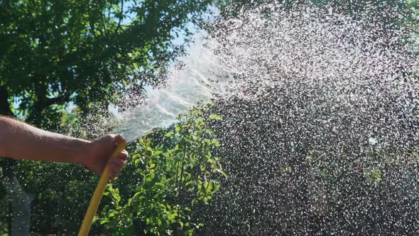 Stream Of Water Spraying From Garden Hose Close Up, Stock Footage 