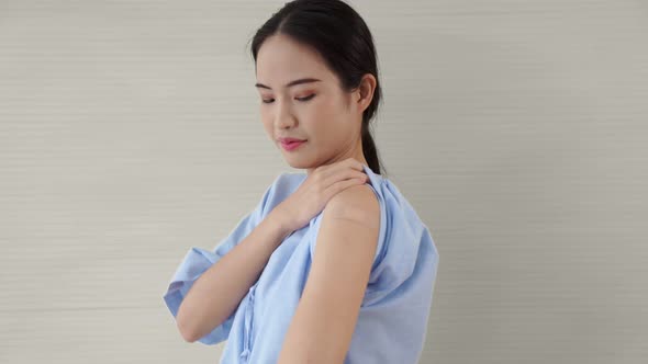 Young Asian Woman Showing COVID19 Vaccine Bandage Merrily alt
