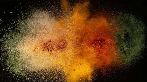 Super Slow Motion Shot of Colorful Seasoning Explosion on Black Background at 1000Fps. alt