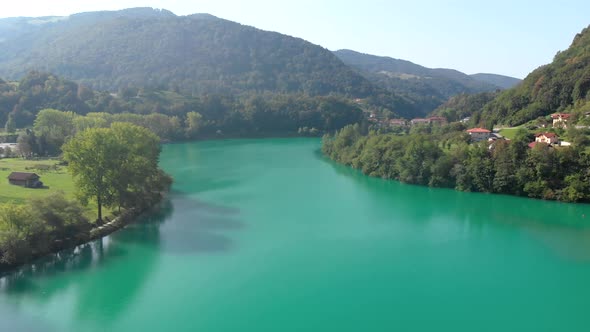 Aerial video of lake at Most na Soci, Slovenia. Flying over idyllic lake. alt