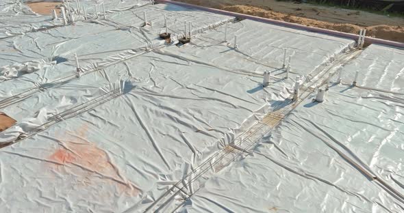 PVC Plastic Pipe in the Outside the House Construction on Sand are Not Finished alt