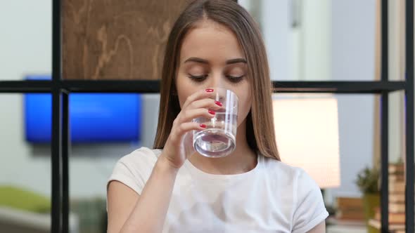 Portrait of Young Girl Drinking Water alt