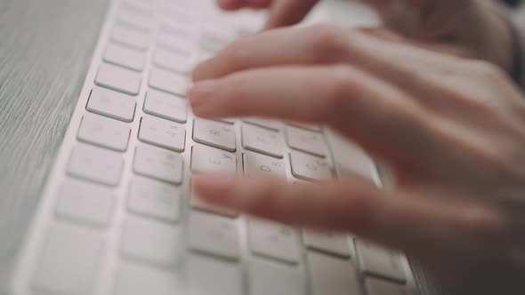 Hands Typing on Keyboard. Close Up of Female Hands Typing Keyboard Buttons alt