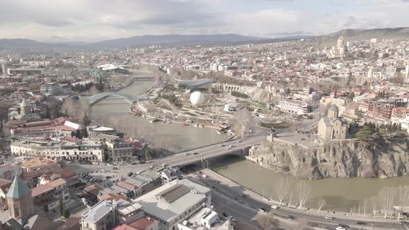 Aerial view of Metekhi church in old Tbilisi located on cliff near river Kura. Georgia 2021 Spring alt