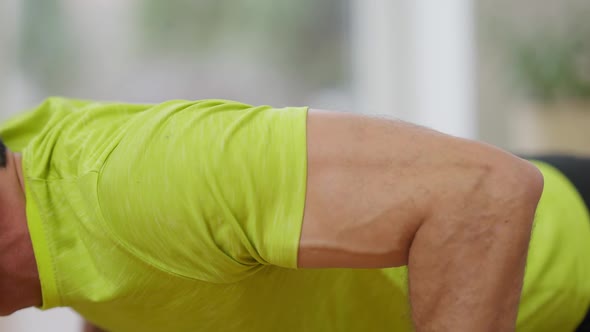 Closeup Hand of Strong Unrecognizable Sportsman Doing Pushups at Home alt