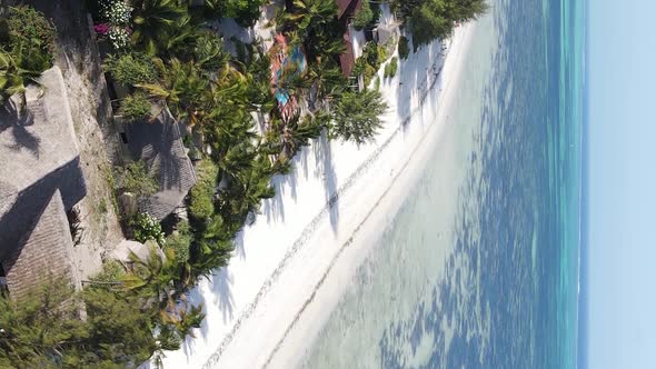 Vertical Video of the Ocean Near the Coast of Zanzibar Tanzania Aerial View alt