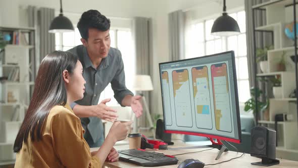 Asian Male And Female Mobile Application Designers Arguing And Discuss New App Features alt