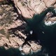 Flying above a man kayaking through mediterranean cliffs - VideoHive Item for Sale