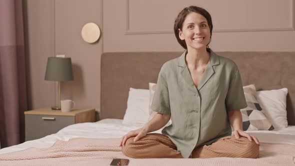 Woman in Loungewear Talking on Camera alt