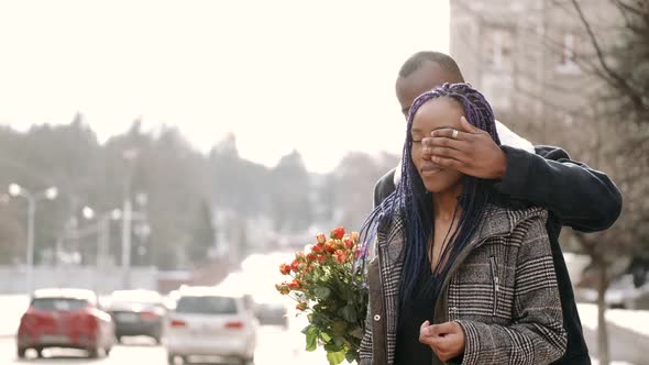 Young African American Couple with Flowers Dating in the City alt