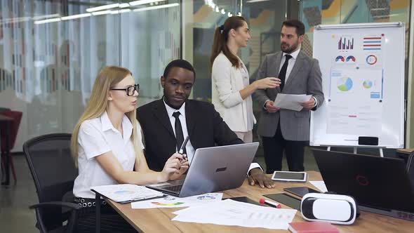 Business People which Working at Computer while Two Another Business Colleagues alt