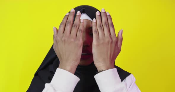 Beautiful African American Girl Wearing Muslim Hijab Over Color Background alt