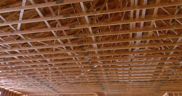 View of the Interior of a Wooden Building Showing the Wood Beam Framework Supported By Wooden Truss alt