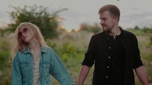 Portrait of Affectionate Happy Loving Couple Walking and Embracing alt