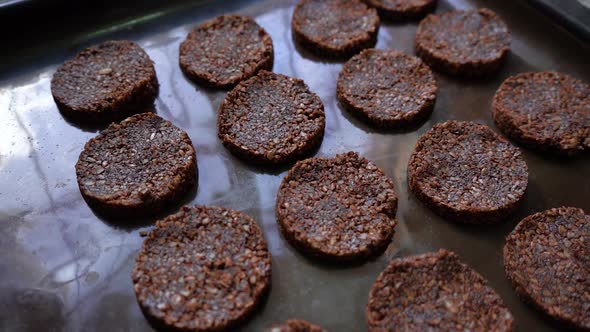 Tray Of Freshly Baked Healthy Cookies With Seeds And Bitter Cocoa. close up, high angle alt