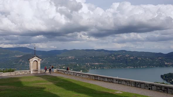 Panoramic view of Orta lake from Madonna del Sasso sanctuary in Italy. Pan left alt