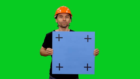 Construction Worker Doing Presentation With Blank Mockup Board 