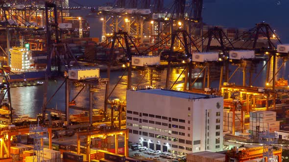 Hong Kong Container Port Terminal and Logistics Center Timelapse at Night Pan Up alt