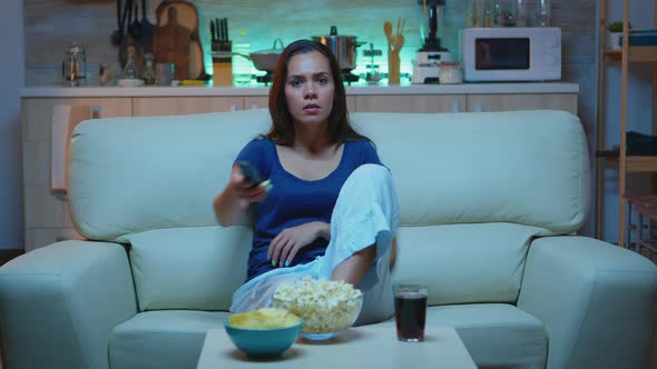 Woman Using Remote Controler alt