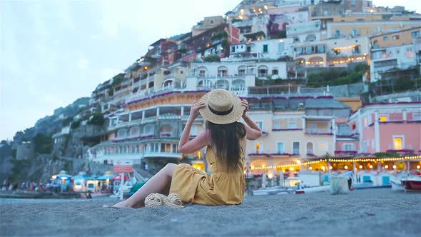 Summer Holiday in Italy. Young Woman in Positano Village on the Background, Amalfi Coast, Italy alt