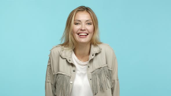 Slow Motion of Happy Beautiful Blond Woman in Fashionable Clothes Laughing and Looking Cheerful at