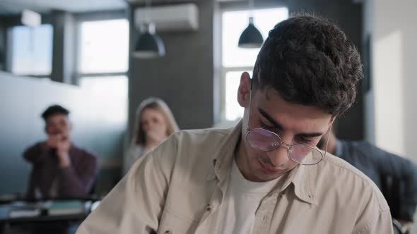 Closeup Young Depressed Student Sitting in Classroom at Desk Alone Feeling Frustrated Stress Unhappy alt