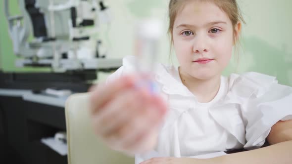 the Girl with a Case of Orthokeratological Contact Lenses alt