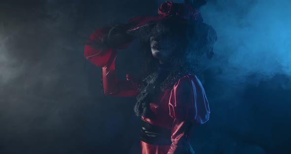 Woman in Red Dress with a Hat Santa Muerte Skull on Her Face Film Grain alt