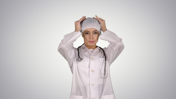 Medical Doctor with Stethoscope Putting Medical Hat Or alt
