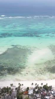 Vertical Video of the Ocean Near the Coast of Zanzibar Tanzania alt