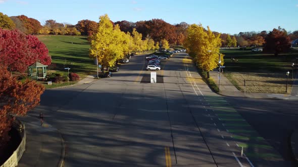 An autumn low angle aerial view of the Schenley Bridge in Pittsburgh's Oakland district. Rise up to alt