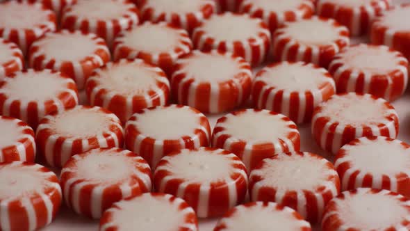 Rotating shot of peppermint candies - CANDY PEPPERMINT  alt