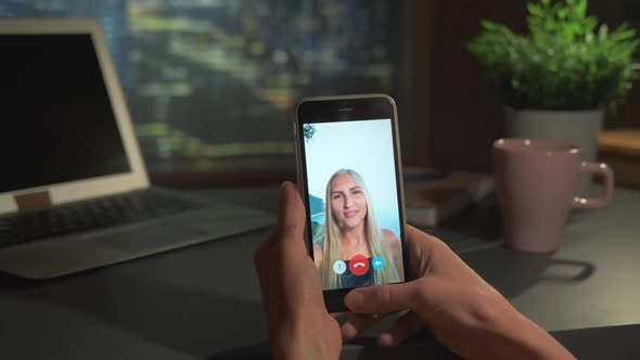Smartphone Screen with Blonde Woman Video Calling From the Seashore