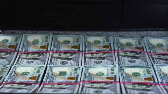 Man Opens and Turns Case Full of Cash Money alt