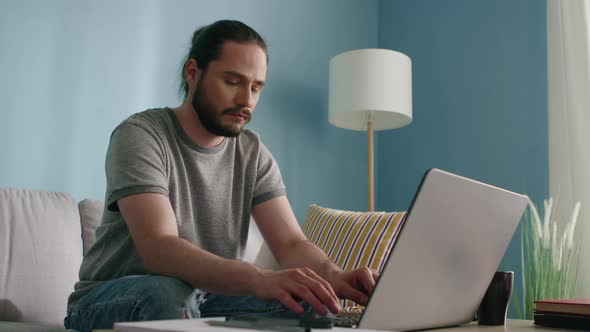 Freelancer Man Works at Home alt