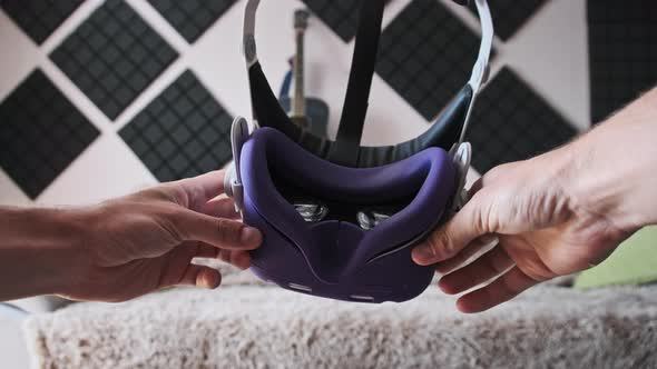 POV of Putting on VR Glasses Virtual Reality in the Living Room alt