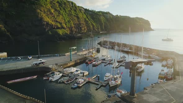 Aerial View Of Small Island Marina During Sunrise