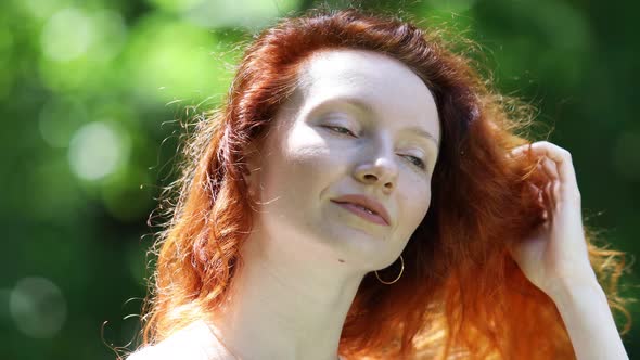 Portrait of a Redhead Middle Aged Woman Outdoors