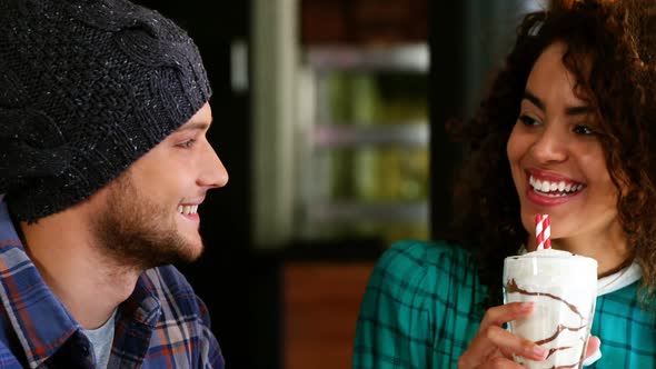 Couple having smoothie in pub alt